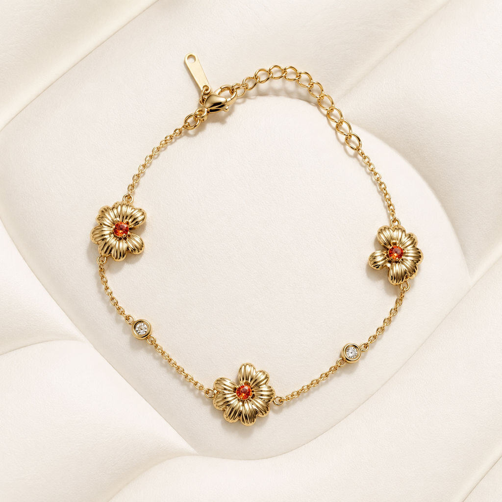 Pulsera Solara dorada con diseño de pequeñas flores