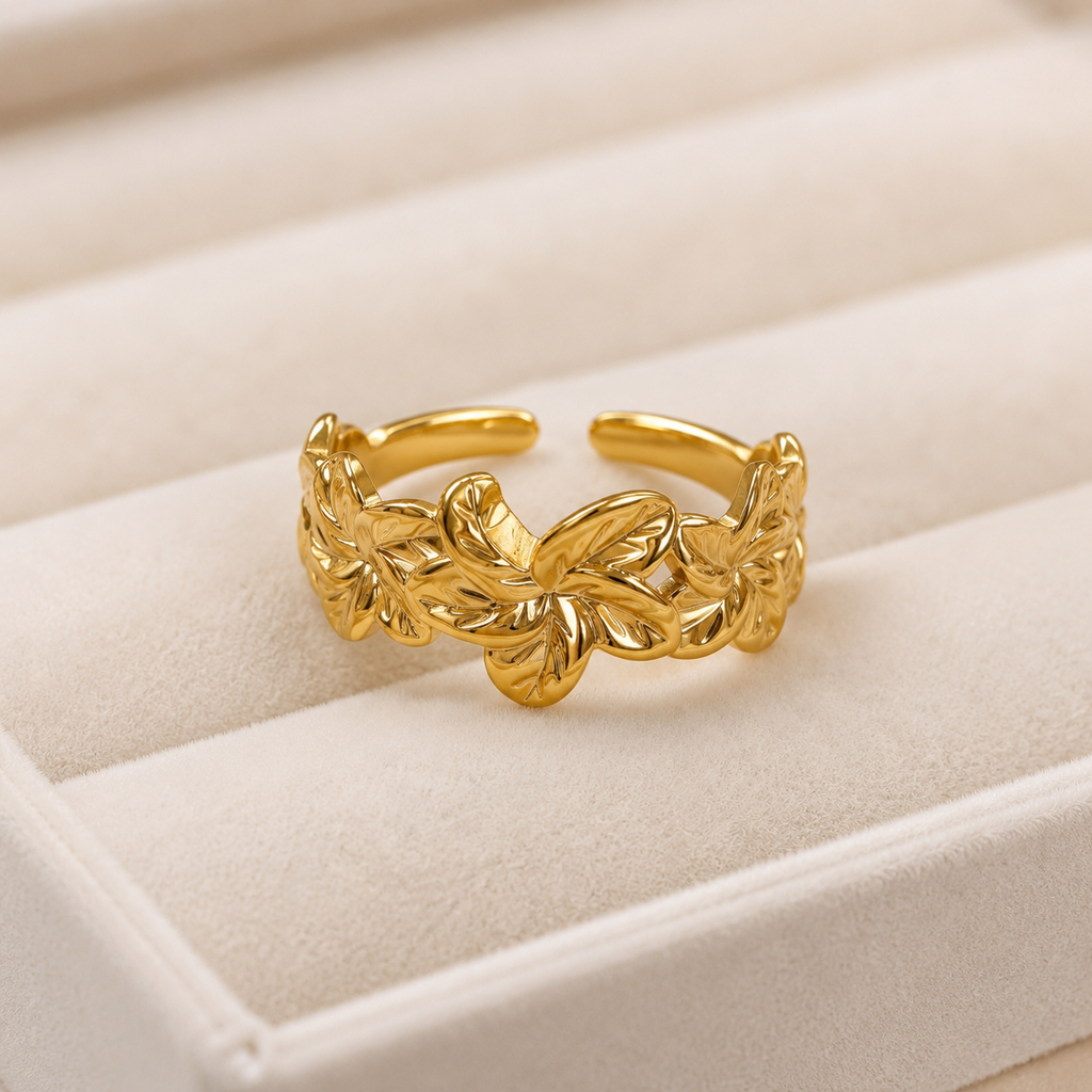 Anillo Virelia dorado abierto con flores en relieve