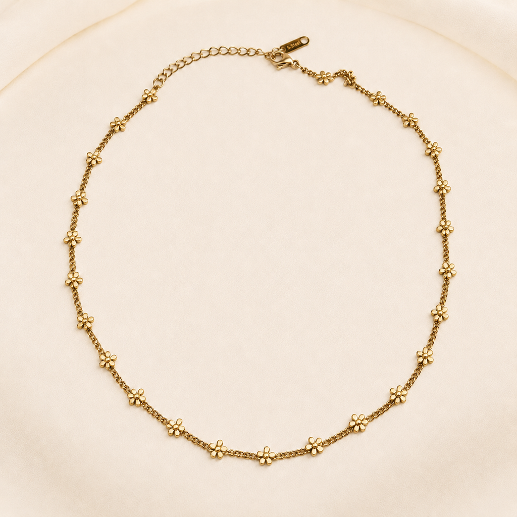 Gold-tone Lianira necklace with small flowers along the chain