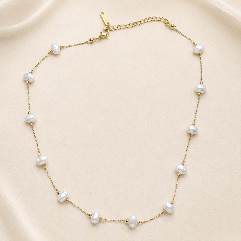 Gold-tone Maralía necklace with pearls spaced along the chain