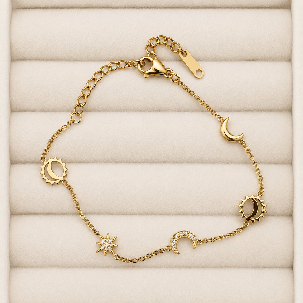 Gold-tone Sorelía bracelet with sun, moon and star charms