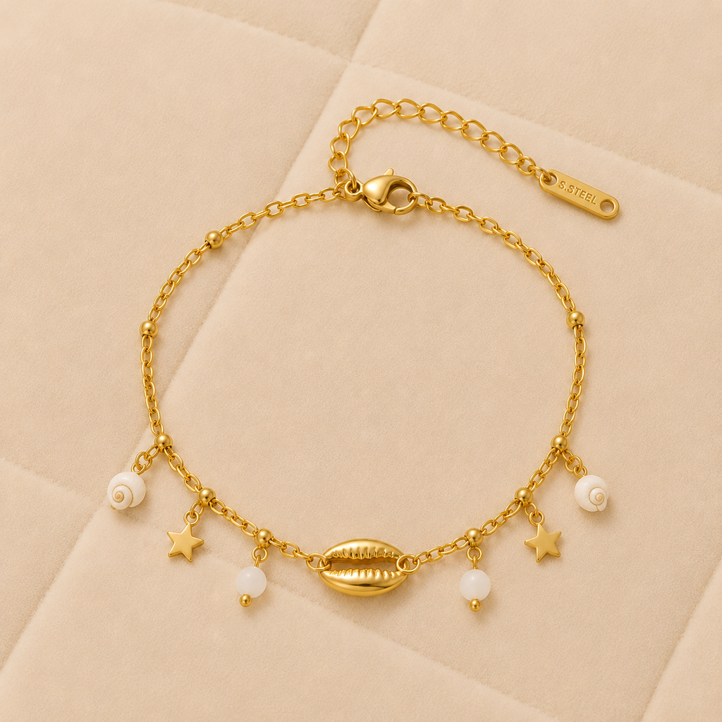 Pulsera Estela Marina con concha central, estrellas y perlas