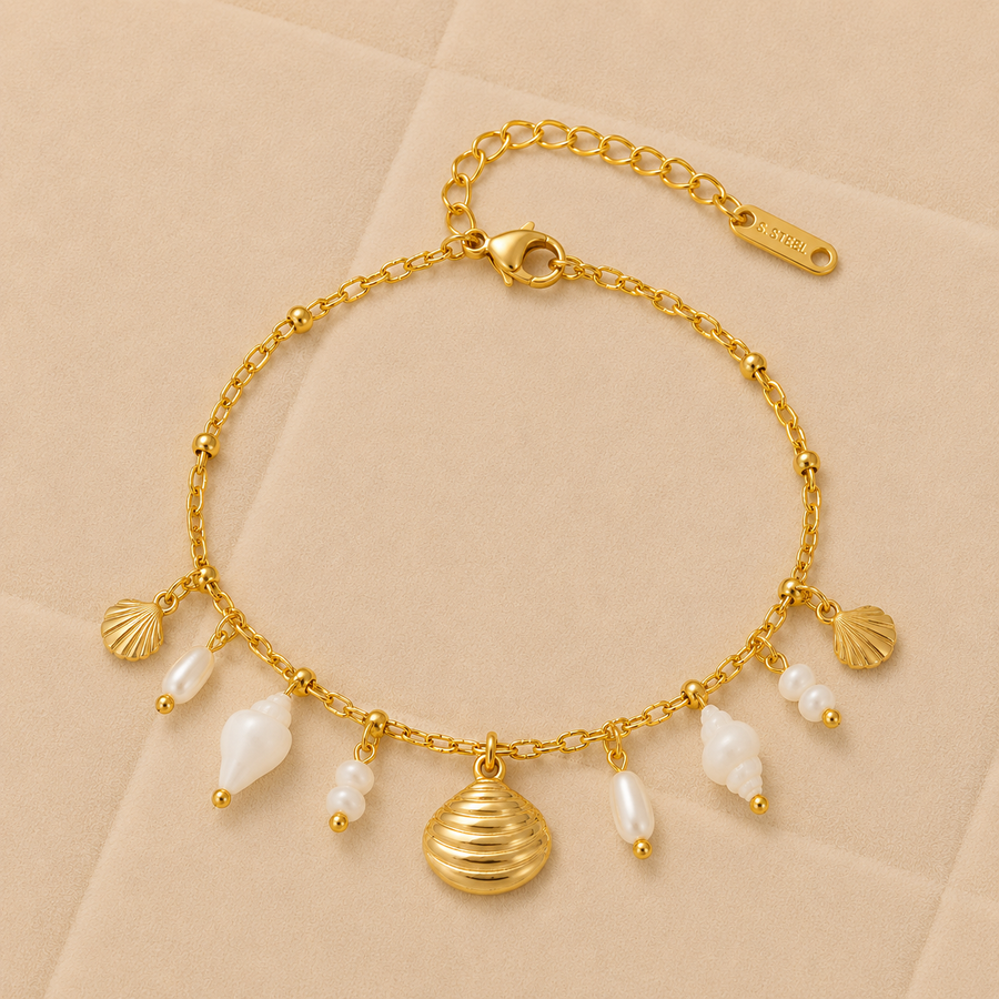 Pulsera Coralia dorada con conchas y perlas de agua dulce